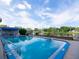 Community pool and deck overlooking a serene waterfront view at 2780 N Riverside Dr # 802, Tampa, FL 33602