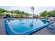 Community pool area with views of the lake and palm trees at this apartment complex at 2780 N Riverside Dr # 802, Tampa, FL 33602