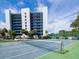 Tennis court with view of the apartment complex, providing residents with recreational opportunities at 2780 N Riverside Dr # 802, Tampa, FL 33602