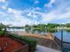 Waterfront view with deck, chairs, and scenic surroundings at 2780 N Riverside Dr # 802, Tampa, FL 33602