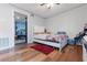 Bedroom featuring wood floors, neutral paint, and a modern ceiling fan at 3212 E Henry Ave, Tampa, FL 33610