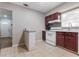 Clean kitchen with granite countertops, white appliances, tile flooring and natural light at 3212 E Henry Ave, Tampa, FL 33610