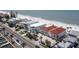 Aerial view of beach condos with red tile roofs and palm trees at 36 Gulf Blvd # 3, Indian Rocks Beach, FL 33785