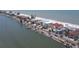 Panoramic aerial perspective of waterfront homes along a scenic coastal road, blending luxury with convenience at 36 Gulf Blvd # 3, Indian Rocks Beach, FL 33785