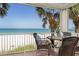 Enjoy the ocean breeze from this balcony with comfortable seating and stunning beach views at 36 Gulf Blvd # 3, Indian Rocks Beach, FL 33785