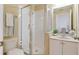 Clean bathroom featuring a glass-enclosed shower, vanity with sink, and toilet, perfect for a refreshing experience at 36 Gulf Blvd # 3, Indian Rocks Beach, FL 33785
