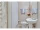 Clean, half bathroom featuring a neutral color palette, with a tub and shower combo at 36 Gulf Blvd # 3, Indian Rocks Beach, FL 33785