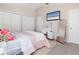 Bright bedroom features plush carpeting, TV, vanity, and dual closets at 36 Gulf Blvd # 3, Indian Rocks Beach, FL 33785