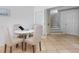Cozy dining area with seating for four and staircase view at 36 Gulf Blvd # 3, Indian Rocks Beach, FL 33785