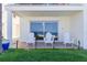 Beachfront patio with three chairs at 36 Gulf Blvd # 3, Indian Rocks Beach, FL 33785