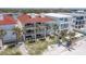 Stunning beachfront property featuring multiple balconies and lush landscaping, offering serene coastal living at 36 Gulf Blvd # 3, Indian Rocks Beach, FL 33785