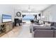 Cozy living room with fireplace and balcony access with ocean views at 36 Gulf Blvd # 3, Indian Rocks Beach, FL 33785