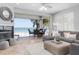 Living room features fireplace, comfortable seating, and access to a balcony with beach views at 36 Gulf Blvd # 3, Indian Rocks Beach, FL 33785