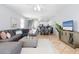Open-concept living space with comfortable sofa, dining area, and easy access to kitchen at 36 Gulf Blvd # 3, Indian Rocks Beach, FL 33785