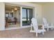 Outdoor patio with seating overlooks the beach at 36 Gulf Blvd # 3, Indian Rocks Beach, FL 33785