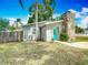 Charming single-story home features a stone chimney and a bright blue front door at 3702 W Reynolds St, Plant City, FL 33563