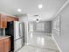 Bright kitchen with stainless steel appliances, granite countertops, and an open view to the living room at 3702 W Reynolds St, Plant City, FL 33563
