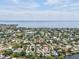 Aerial view of neighborhood with the home indicated by a red arrow, showcasing the waterfront access at 4501 Huntington Ne St, St Petersburg, FL 33703