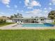 An inviting backyard with an in-ground pool, lounge chairs and a covered patio at 4501 Huntington Ne St, St Petersburg, FL 33703