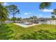 Lush backyard featuring a private pool, a lounge area, and a well-maintained lawn at 4501 Huntington Ne St, St Petersburg, FL 33703