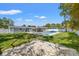Spacious backyard featuring a pool, patio area with lounge chairs, and a fenced yard with green grass at 4501 Huntington Ne St, St Petersburg, FL 33703