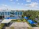 Bright school exterior with a playground featuring swings, a slide, a basketball court, and seating areas at 4501 Huntington Ne St, St Petersburg, FL 33703