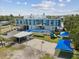 Modern school exterior featuring a colorful playground with swings, a slide, and a basketball court at 4501 Huntington Ne St, St Petersburg, FL 33703