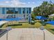 Vibrant school exterior featuring a playground with swings, a slide, a basketball court, and shade covers at 4501 Huntington Ne St, St Petersburg, FL 33703