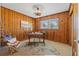 Home office featuring wood-paneled walls, area rug and desk by the window at 4501 Huntington Ne St, St Petersburg, FL 33703