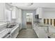 Bright kitchen featuring granite counters and white cabinetry awaiting renovation at 4501 Huntington Ne St, St Petersburg, FL 33703