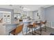 Kitchen bar showcasing granite countertop and views to stainless steel refrigerator and outdoor pool at 4501 Huntington Ne St, St Petersburg, FL 33703