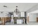 Spacious kitchen awaiting renovation with tile floors and open layout with an island at 4501 Huntington Ne St, St Petersburg, FL 33703