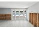 Spacious living room with tile flooring, patio doors and views of the outdoor pool at 4501 Huntington Ne St, St Petersburg, FL 33703
