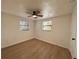 Bedroom featuring hardwood floors, a ceiling fan, and natural light at 4623 Irene Loop, New Port Richey, FL 34652