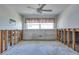 Bedroom with large window and ceiling fan at 511 64Th Ave, St Pete Beach, FL 33706