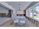 Spacious dining room featuring large windows, chandelier lighting, and clear acrylic chairs at 511 64Th Ave, St Pete Beach, FL 33706