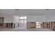 Entryway during renovation, revealing studs, and a view of the bright, open interior through double doors at 511 64Th Ave, St Pete Beach, FL 33706