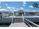 Waterfront home with a private dock, pool, and scenic views from the outdoor deck at 511 64Th Ave, St Pete Beach, FL 33706