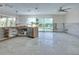 Kitchen area overlooking pool and water views featuring stainless steel appliances at 511 64Th Ave, St Pete Beach, FL 33706