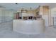 Open kitchen featuring light cabinets, tile floors and stainless steel appliances at 511 64Th Ave, St Pete Beach, FL 33706