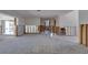 Open concept living room during renovation with exposed wall studs and a mix of flooring at 511 64Th Ave, St Pete Beach, FL 33706