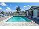 Enjoy a backyard pool with a spacious deck perfect for relaxation at 511 64Th Ave, St Pete Beach, FL 33706