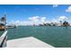 Scenic waterfront view with a private boat dock and peaceful surroundings on a beautiful sunny day at 511 64Th Ave, St Pete Beach, FL 33706