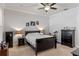 Spacious bedroom with a large bed, dark wood furniture, crown molding, and soft lighting, offering a relaxing retreat at 6011 Caldera Ridge Dr, Lithia, FL 33547