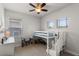 Bright bedroom featuring a bunk bed, ceiling fan, and carpeted floor, perfect for a playful space at 6011 Caldera Ridge Dr, Lithia, FL 33547