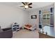 bedroom with playful decor, comfortable armchair, and ample natural light at 6011 Caldera Ridge Dr, Lithia, FL 33547