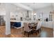 Open concept living with dining area and kitchen featuring stainless steel appliances and a center island at 6011 Caldera Ridge Dr, Lithia, FL 33547