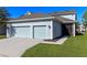 Charming home with a two-car garage, screened in lanai, and a well-maintained lawn at 6011 Caldera Ridge Dr, Lithia, FL 33547