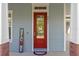 Inviting front door with glass details, complemented by a 'Welcome' sign and attractive exterior accents at 6011 Caldera Ridge Dr, Lithia, FL 33547