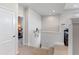 Inviting hallway with carpeted stairs, featuring a view into a bedroom and neutral wall colors at 6011 Caldera Ridge Dr, Lithia, FL 33547